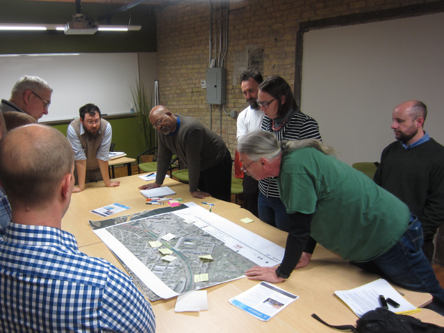 team members evaluate a proposed infrastructure solution.